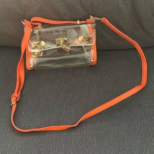 Clear purse with orange detailing